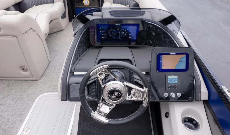 Slide: The Image of The image shows the cockpit of a Barletta Lusso 23U boat with modern instruments. - 26