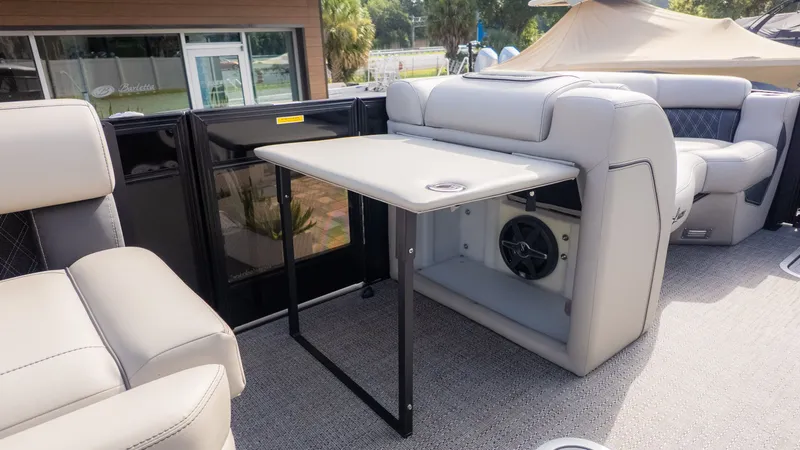 Slide: The Image of The image shows the interior of a 2026 Barletta Lusso L23M boat with a table. - 16