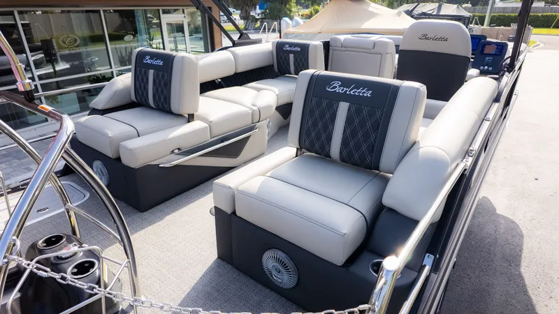 Slide: The Image of Luxurious seating on a Barletta Lusso L23M pontoon boat, featuring elegant upholstery and modern design. - 6
