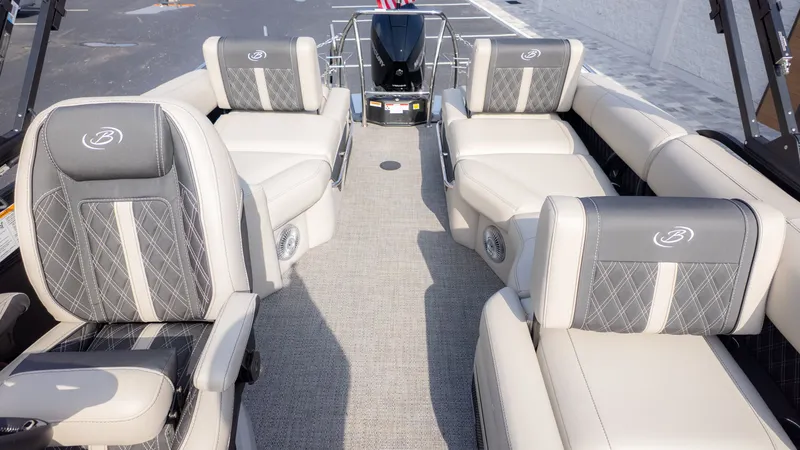 Slide: The Image of The image shows the interior of a Barletta Lusso L23M pontoon boat with luxurious seating. - 9