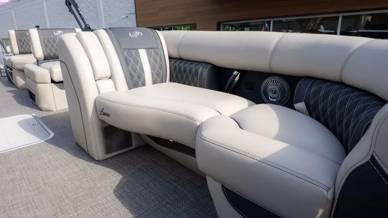 Slide: The Image of Luxurious, cushioned seating on a modern boat with sleek details and high-quality materials. - 18