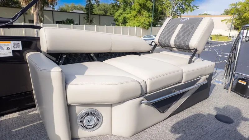 Slide: The Image of The image shows a luxurious seating area on a boat with gray upholstery. - 10