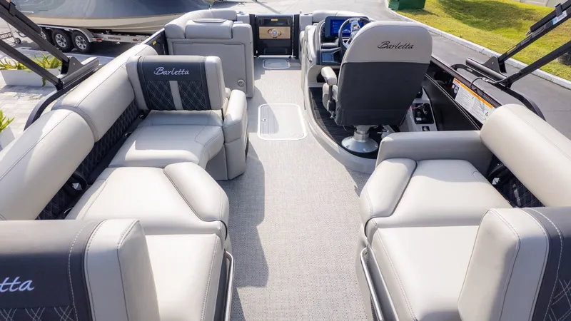 Slide: The Image of Interior of a luxury pontoon boat with sleek seating and a modern cockpit. - 6