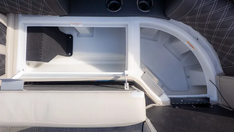 Slide: The Image of Interior view of a 2026 Barletta Lusso L23M with storage compartment and cushioned seating. - 18