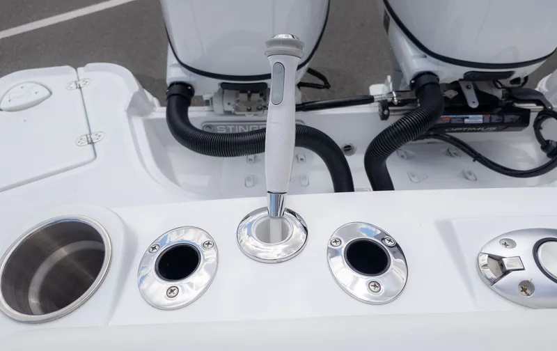 Slide: The Image of Close-up of the throttle lever and engine controls on a boat. - 12