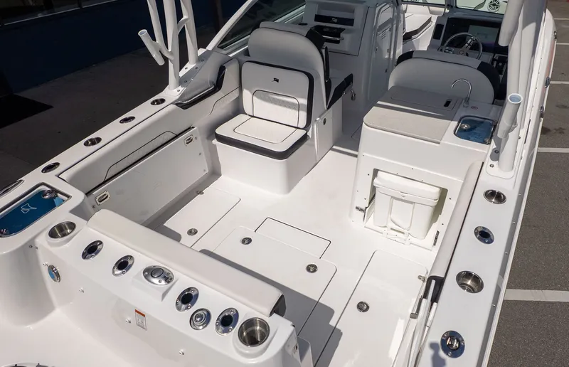 Slide: The Image of The image shows the cockpit of a modern boat with white seating and a helm console. - 8