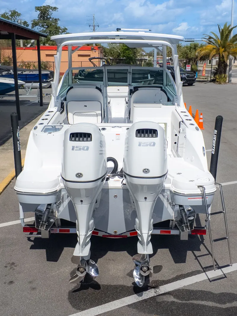 Slide: The Image of The image shows a 2026 Stingray 259 DC boat with twin outboard engines. - 6