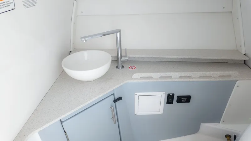 Slide: The Image of Interior of a modern boat cabin with a sink and faucet. - 28