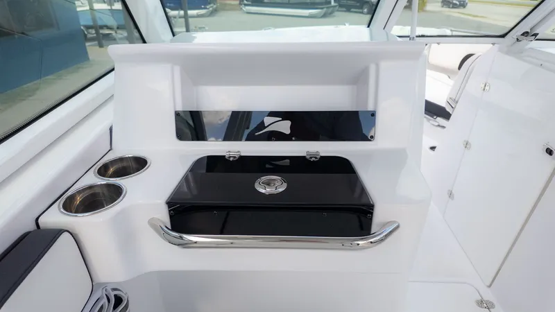 Slide: The Image of Interior view of a modern boat with white interior and stainless steel accents. - 21