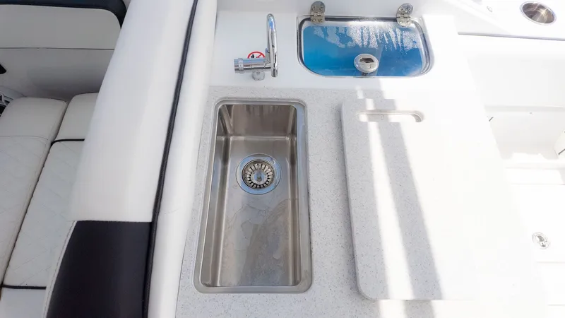 Slide: The Image of The image shows a sink and faucet on a boat. - 18
