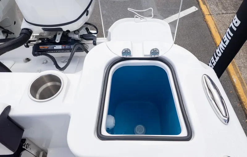 Slide: The Image of A modern boat cooler with a blue interior and stainless steel fittings. - 9