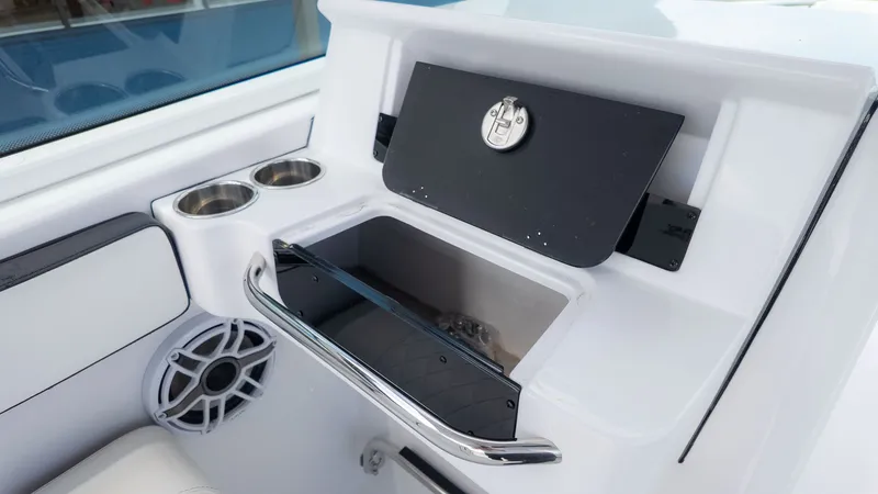 Slide: The Image of The image shows a white boat cockpit with cup holders and a speaker. - 20