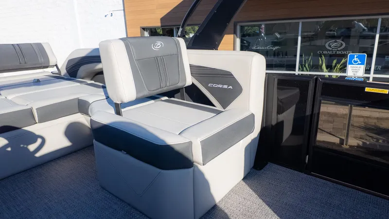 Slide: The Image of The image shows the seating area of a Barletta Corsa X23U boat with gray upholstery. - 15