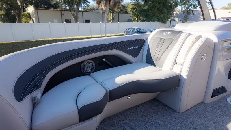 Slide: The Image of The image shows the sleek gray and black seating of a Barletta Corsa X23U boat. - 20