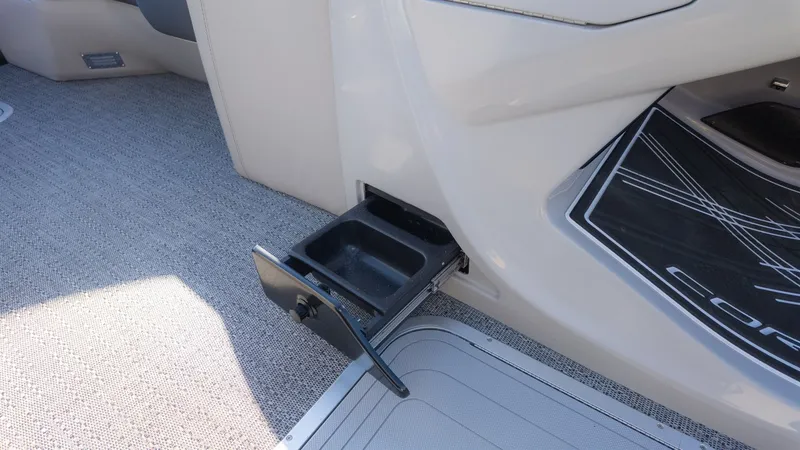 Slide: The Image of An open storage compartment in the carpeted floor of a boat. - 20