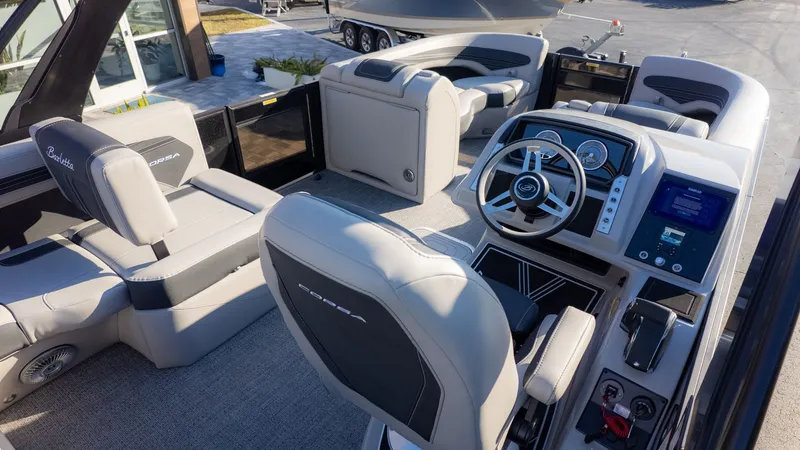 Slide: The Image of The image shows the cockpit of a Barletta Corsa X23U boat with modern seating and controls. - 11