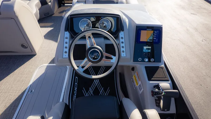 Slide: The Image of The image shows the helm of a Barletta Corsa X23U boat with modern instruments. - 22