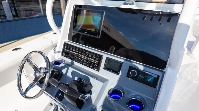 Slide: The Image of Dashboard of a 2026 Tidewater 256 CC Adventure with modern instruments and controls. - 18