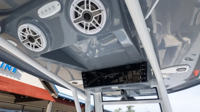 Slide: The Image of The image shows a boat's roof with speakers and a control panel. - 15