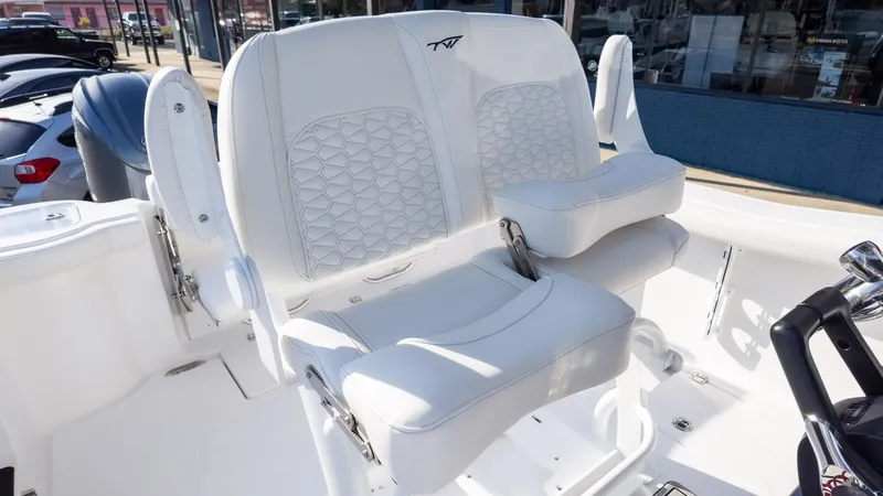 Slide: The Image of The Tidewater 256 CC Adventure cockpit seats are white and cushioned. - 21