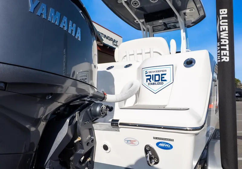 Slide: The Image of The image shows the stern of a Tidewater 256 CC Adventure boat with a Yamaha engine. - 5