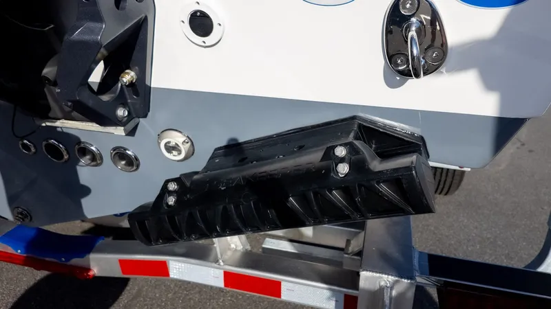 Slide: The Image of Close-up of a boat's stern with a trim system and trailer. - 6