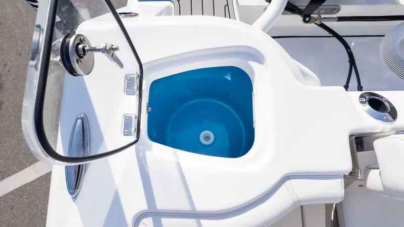 Slide: The Image of A boat with a blue round compartment and white upholstery. - 7
