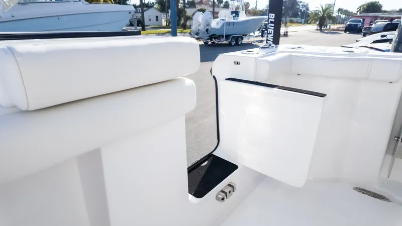 Slide: The Image of The image shows the cockpit of a Tidewater 256 CC Adventure boat with white upholstery. - 5