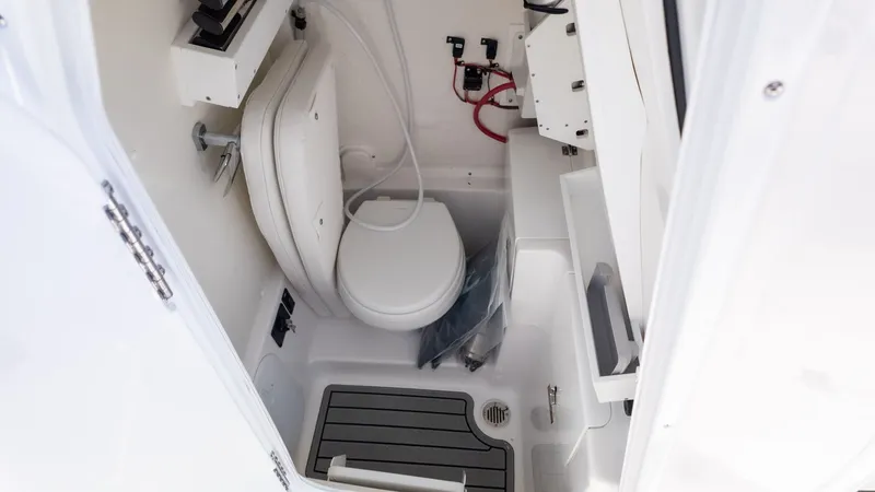 Slide: The Image of Interior view of a boat with a toilet and sink. - 25