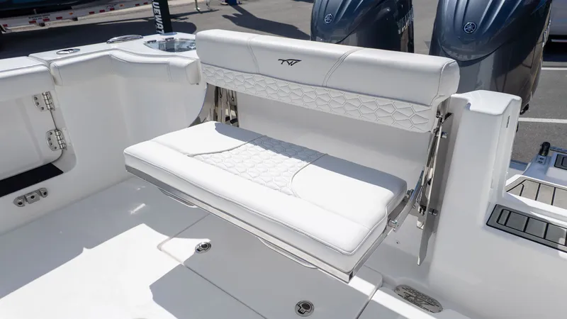Slide: The Image of The 2026 Tidewater 256 CC Adventure features a sleek white bench seat with a modern design. - 6