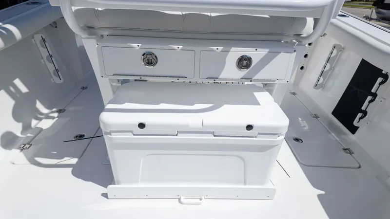Slide: The Image of The image shows the cockpit of a Tidewater 256 CC Adventure boat with storage and seating. - 6