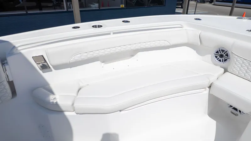 Slide: The Image of The image shows a white seating area on a boat with elegant detailing. - 11