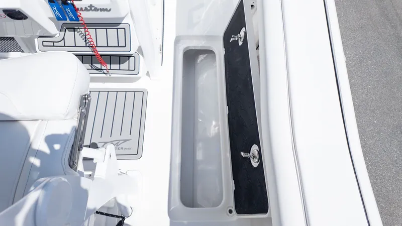 Slide: The Image of The image shows the cockpit of a Tidewater 256 CC Adventure boat with a built-in sink. - 18
