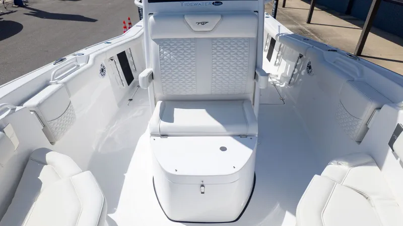 Slide: The Image of The image shows the cockpit of a Tidewater 256 CC Adventure boat with white upholstery. - 15