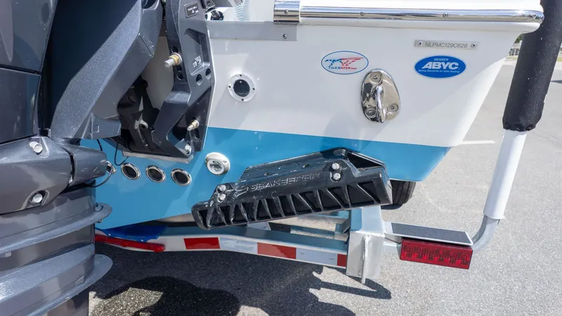 Slide: The Image of Close-up of the stern of a Tidewater 256 CC Adventure boat with motor and accessories. - 3