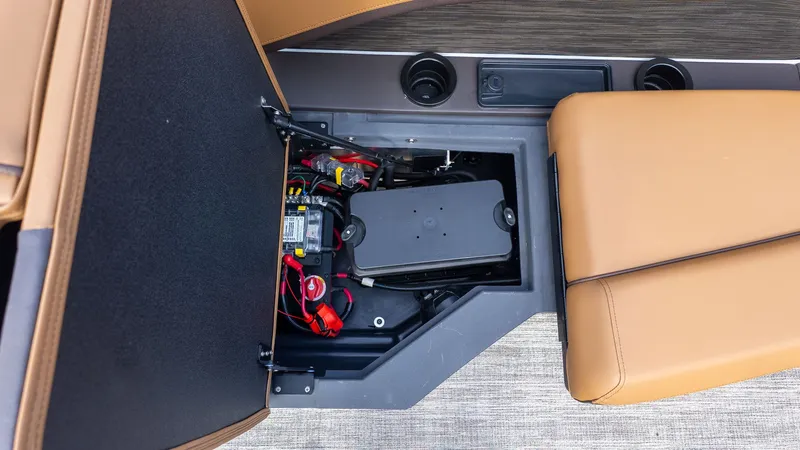Slide: The Image of View of storage under a seat with batteries and wiring. - 7