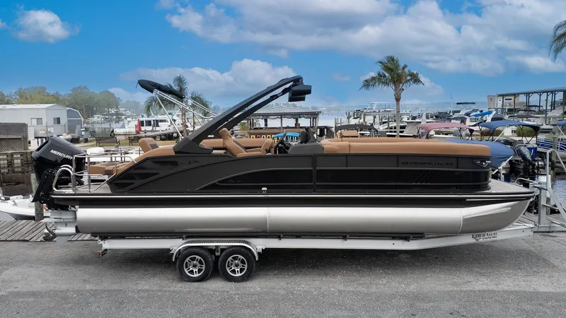 Slide: The Image of Bennington 26 M STERN LOUNGE 2026 on a trailer at a dock. - 26