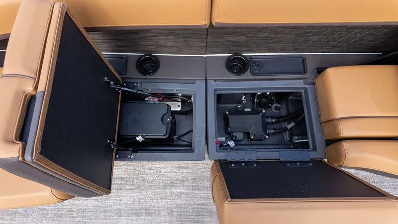 Slide: The Image of Close-up of the lounge seating with open storage compartments and visible wiring. - 8