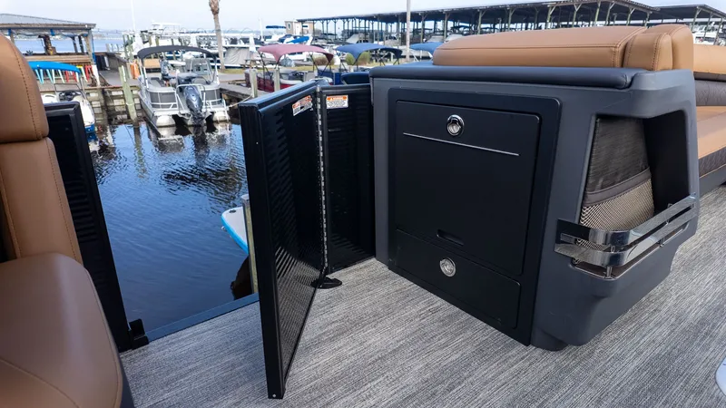 Slide: The Image of 2026 Bennington 26 M STERN LOUNGE with sleek features at the marina. - 11