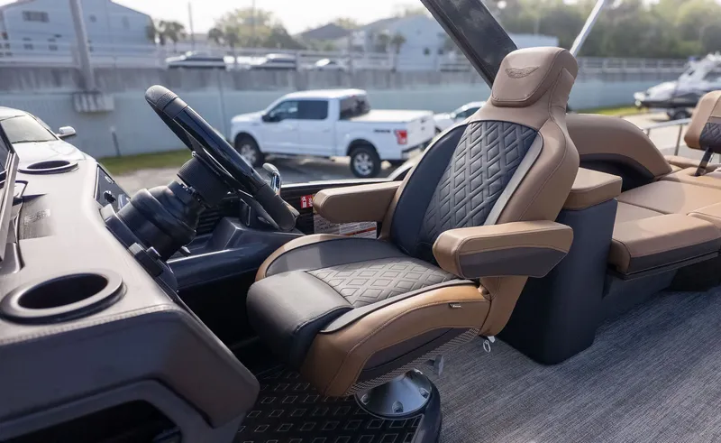 Slide: The Image of Luxurious captain's chair on a Bennington 26 M STERN LOUNGE boat, featuring elegant stitching and armrests. - 21