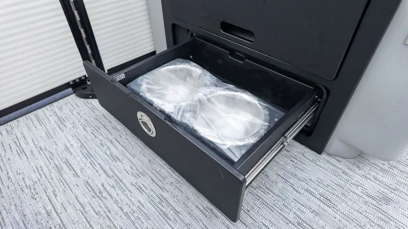 Slide: The Image of An open drawer cabinet with two round containers wrapped in plastic. - 9