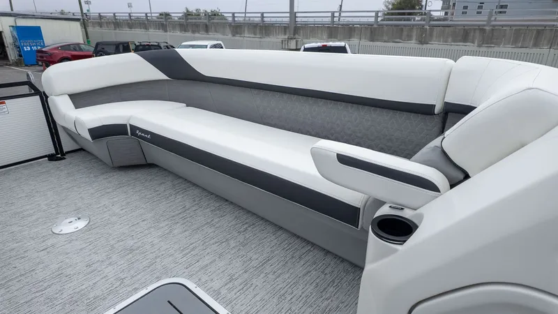 Slide: The Image of Interior view of a Bennington 26 M STERN LOUNGE boat with sleek gray and white upholstery. - 14