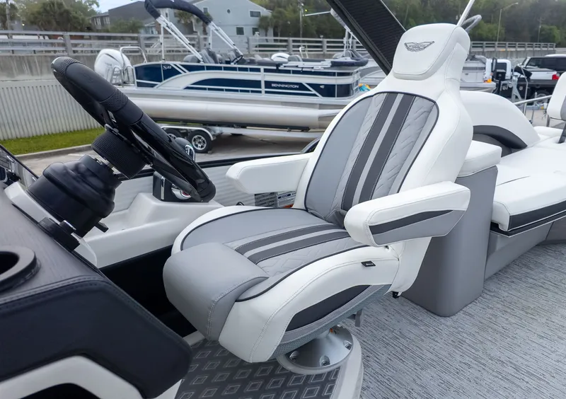 Slide: The Image of Bennington 26 M STERN LOUNGE 2026: Luxurious captain's chair with gray and white upholstery. - 19