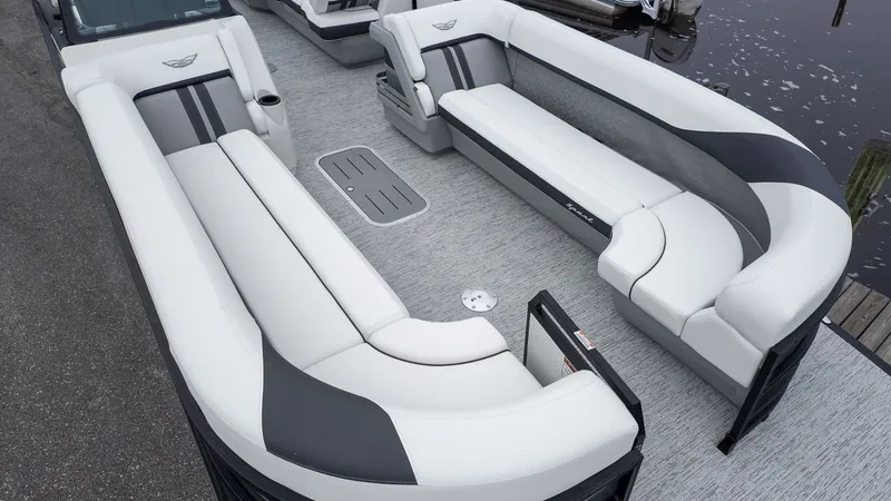 Slide: The Image of The image shows the deck of a Bennington 26 M STERN LOUNGE boat with luxurious seating. - 16