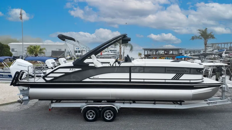 Slide: The Image of Bennington 26 M STERN LOUNGE 2026 on a trailer outdoors. - 22