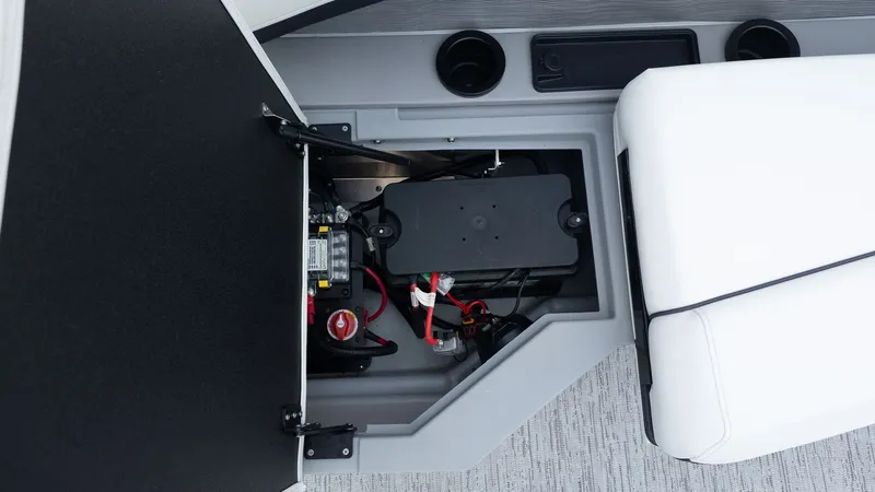 Slide: The Image of View of a boat's battery compartment with white upholstery and gray flooring. - 4
