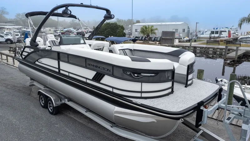 Slide: The Image of Bennington 26 M STERN LOUNGE 2026 on a trailer, ready for the water. - 24