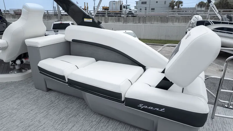 Slide: The Image of The image shows a luxurious white seating lounge on a boat. - 3