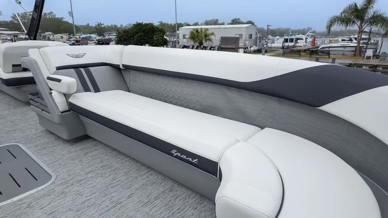 Slide: The Image of Bennington 26 M STERN LOUNGE 2026: Elegant seating with gray and white upholstery. - 15
