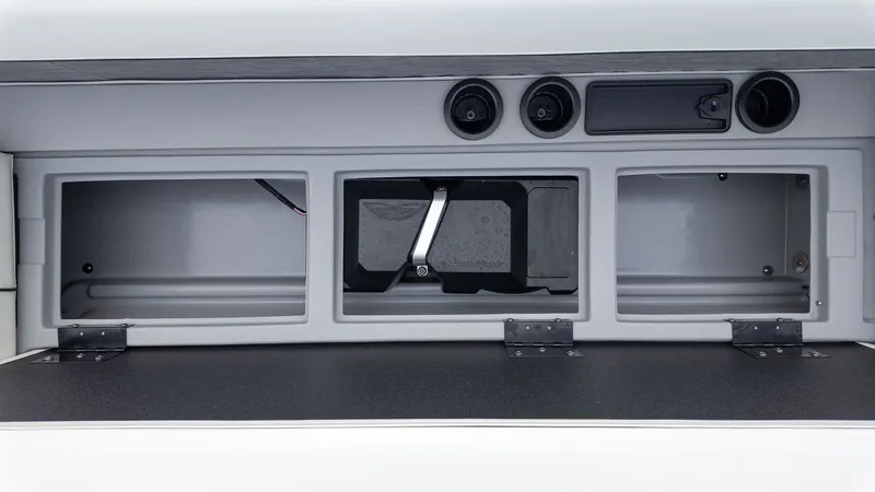 Slide: The Image of Interior view of a boat with three open storage compartments and speakers. - 14